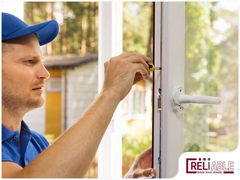 Image 15 A repairman installing one of the best windows for home remodel projects